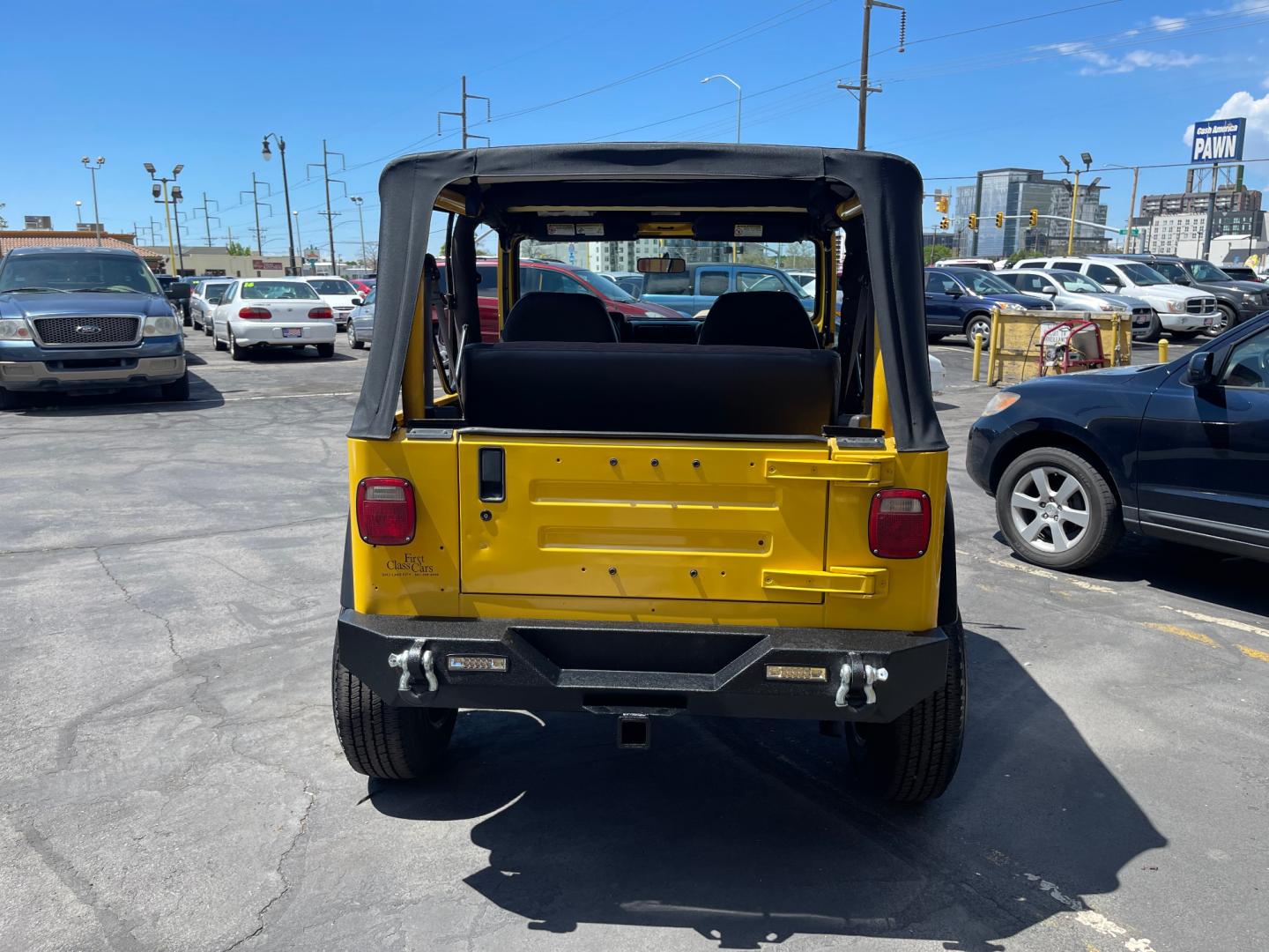 2000 Solar Yellow /Black Jeep Wrangler SE (1J4FA29P9YP) with an 2.5L 4 Cyl. engine, Manual transmission, located at 801 South State Street, Salt Lake City, UT, 84111, (801) 328-0098, 40.751953, -111.888206 - Wow extremely rare to find extra clean Jeep in immaculate condition 4x4! Low miles only 98,248 miles! Interior and exterior are both in excellent shape for the year. This is a clean title no reported accidents on the CarFax history report. It has passed emissions already and is ready to go. Featur - Photo#6